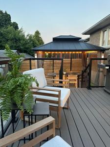 Elevated composite deck with a steel gazebo in Paris, ON.